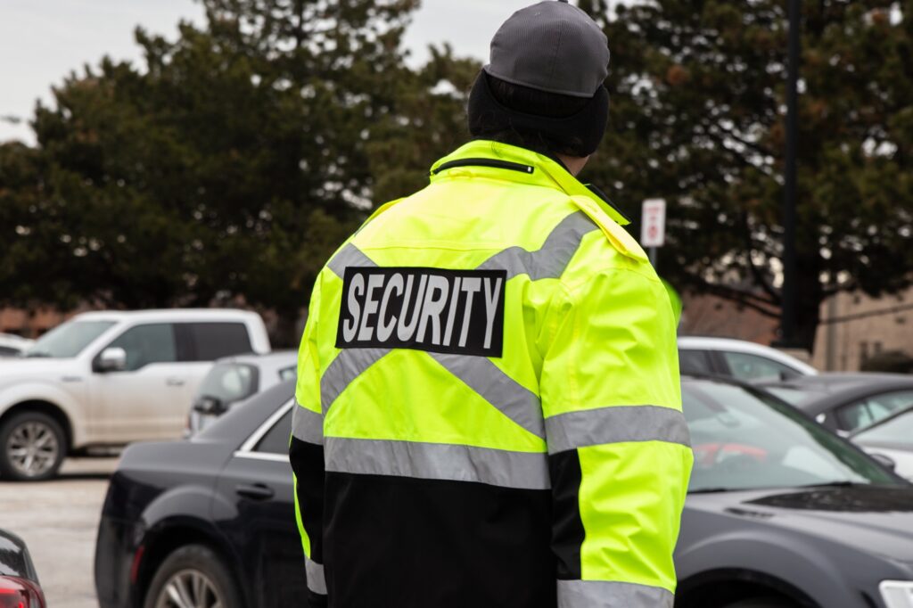 Rear view of parking security watching over the parking area